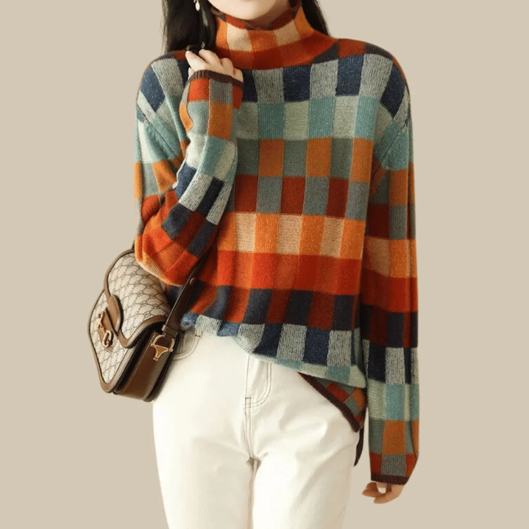 Women's turtleneck sweater featuring a colorful patchwork design, made from soft, warm knit fabric for comfort and style.