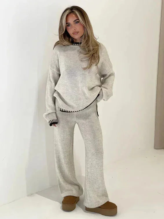 Women's relaxed fit sweater and pants set made from soft cotton blend, featuring a casual design with ribbed cuffs and…