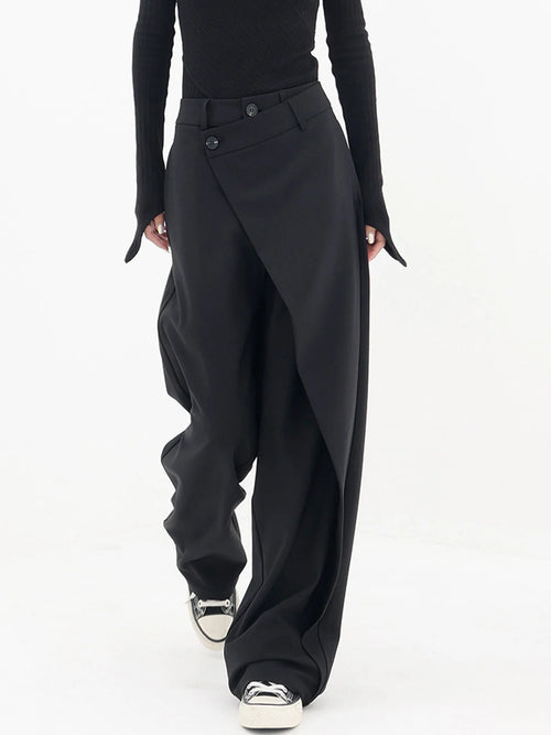 Asymmetrical layer wide-leg dress pants with button details, crafted from soft fabric for a comfortable and stylish fit.