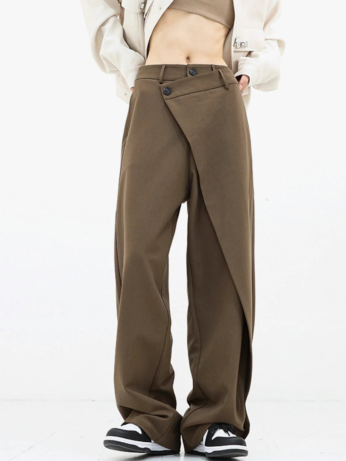 Asymmetrical layer wide-leg buttoned dress pants made from soft fabric, featuring a unique silhouette and versatile style.