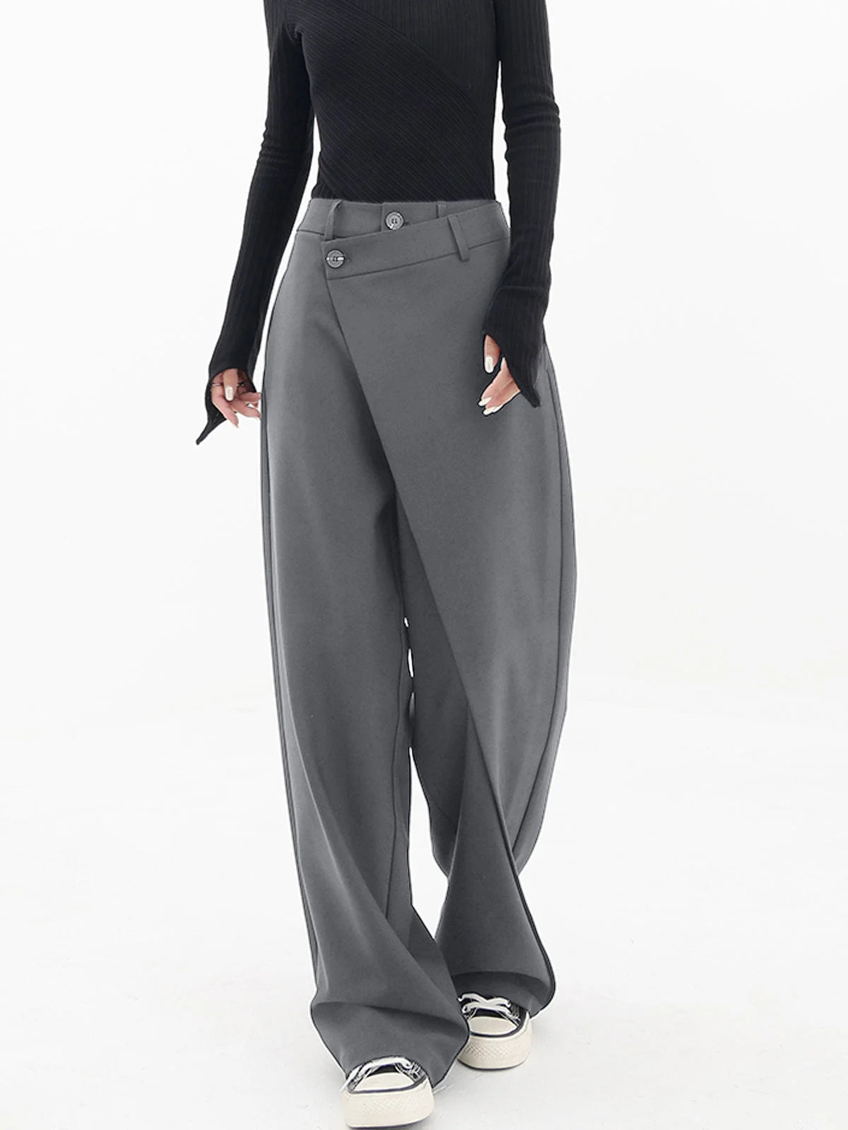 Asymmetrical layer wide-leg buttoned dress pants in soft fabric, featuring a trendy design and elegant button details.