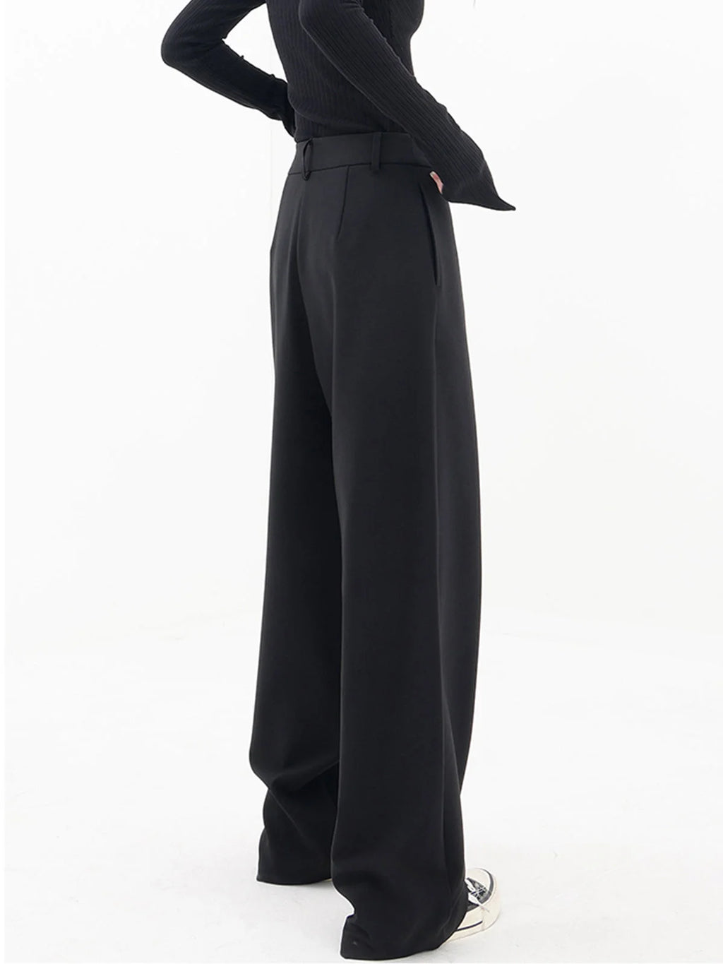 Asymmetrical layer wide-leg dress pants with button detailing, crafted from soft cotton-blend fabric for comfort and style.