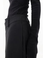 Asymmetrical layer wide-leg dress pants featuring button details, made from soft, flowing fabric for a relaxed fit.