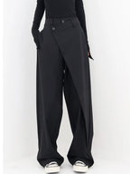 Asymmetrical layer wide-leg buttoned dress pants in lightweight fabric, featuring a unique layered design and button closure.