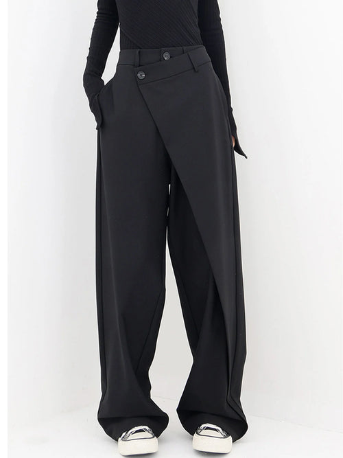 Asymmetrical layer wide-leg buttoned dress pants in lightweight fabric, featuring a unique layered design and button closure.