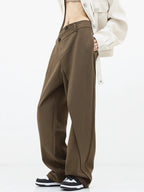 Asymmetrical layer wide-leg dress pants featuring button details, made from soft, breathable fabric for comfort and style.