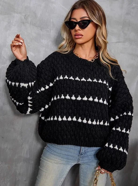 Cozy textured sweater featuring a patterned design with soft fabric and a relaxed fit, perfect for casual wear.