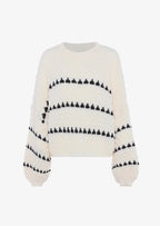 Cozy textured sweater featuring a patterned design, made from soft, breathable fabric for comfort and style.