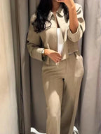 Alt text: Women's 2-piece set featuring a tailored jacket and wide-leg trousers, made from breathable fabric for comfort and…