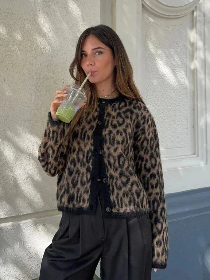 Women's animal print button-up cardigan in soft knit fabric, featuring a stylish pattern and versatile button closure.