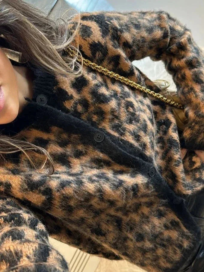 Women's animal print button-up cardigan in soft knit fabric, featuring a relaxed fit and long sleeves for casual layering.