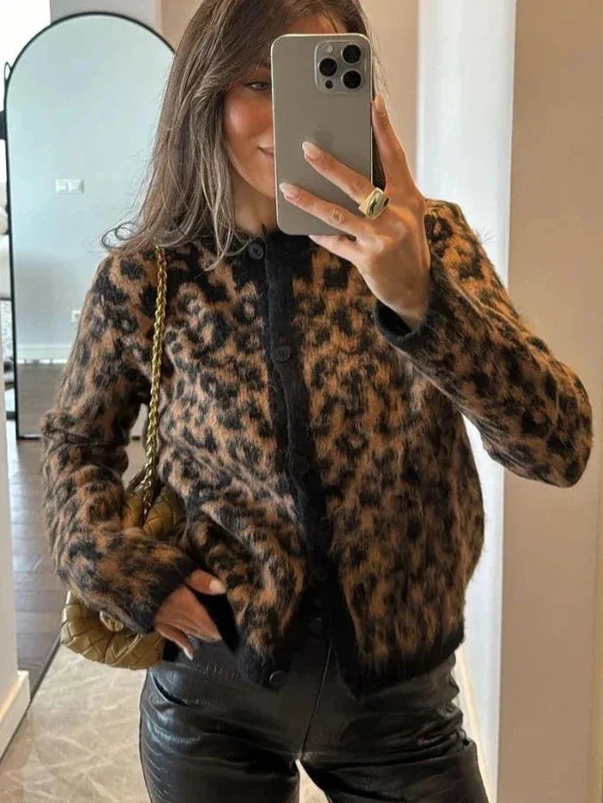 Women's animal print button-up cardigan made of soft fabric, featuring a classic design and long sleeves for a stylish layer.