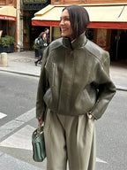 Women's army green jacket featuring a zip front, stand collar, durable fabric, and practical pockets for everyday wear.