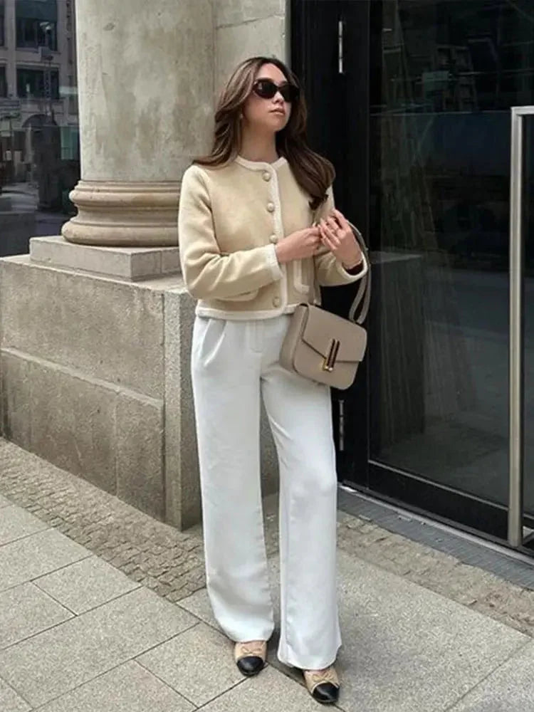 Beige cropped cardigan for women, featuring a button front design, made from soft, lightweight knit fabric for comfort.