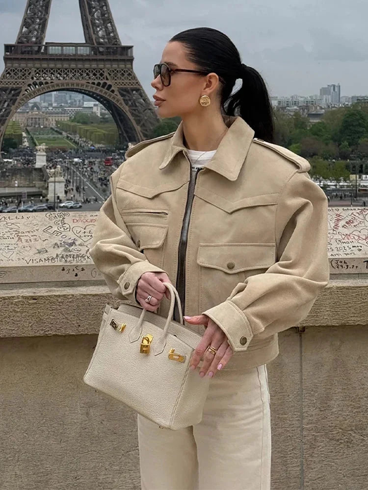 Women's beige suede cropped jacket featuring a stylish lapel collar and soft texture for a comfortable fit.
