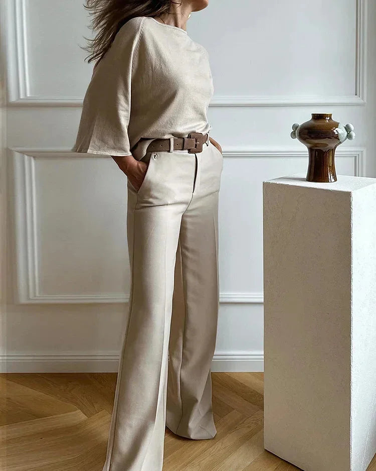 Women's beige two-piece set featuring a belted top and wide-leg pants made from soft, breathable cotton blend fabric.