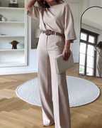 Women's beige two-piece set featuring a belt and matching pants, made from soft, breathable fabric for all-day comfort.