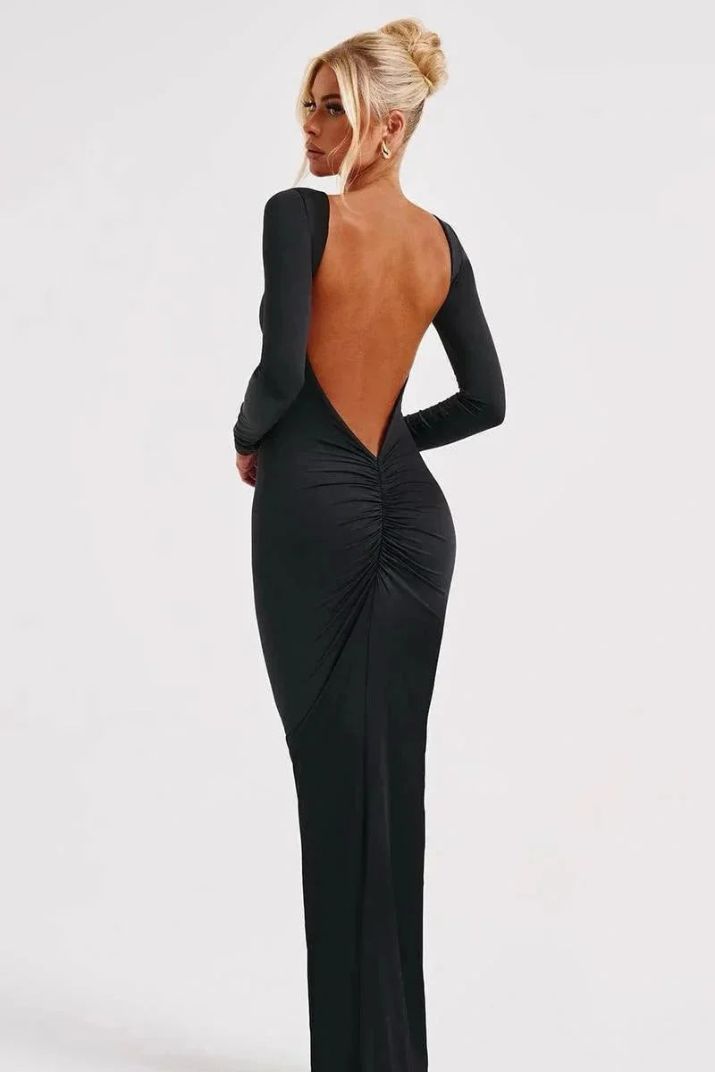 Women's black long sleeve bodycon maxi dress with an open back, made from stretchy fabric for a fitted silhouette.