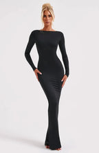 Women's black long sleeve bodycon maxi dress with an open back design, made from soft, stretchy fabric for a comfortable fit.