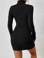 Women's black ribbed knit longsleeve mini dress featuring a fitted silhouette and soft, stretchy fabric for comfort.