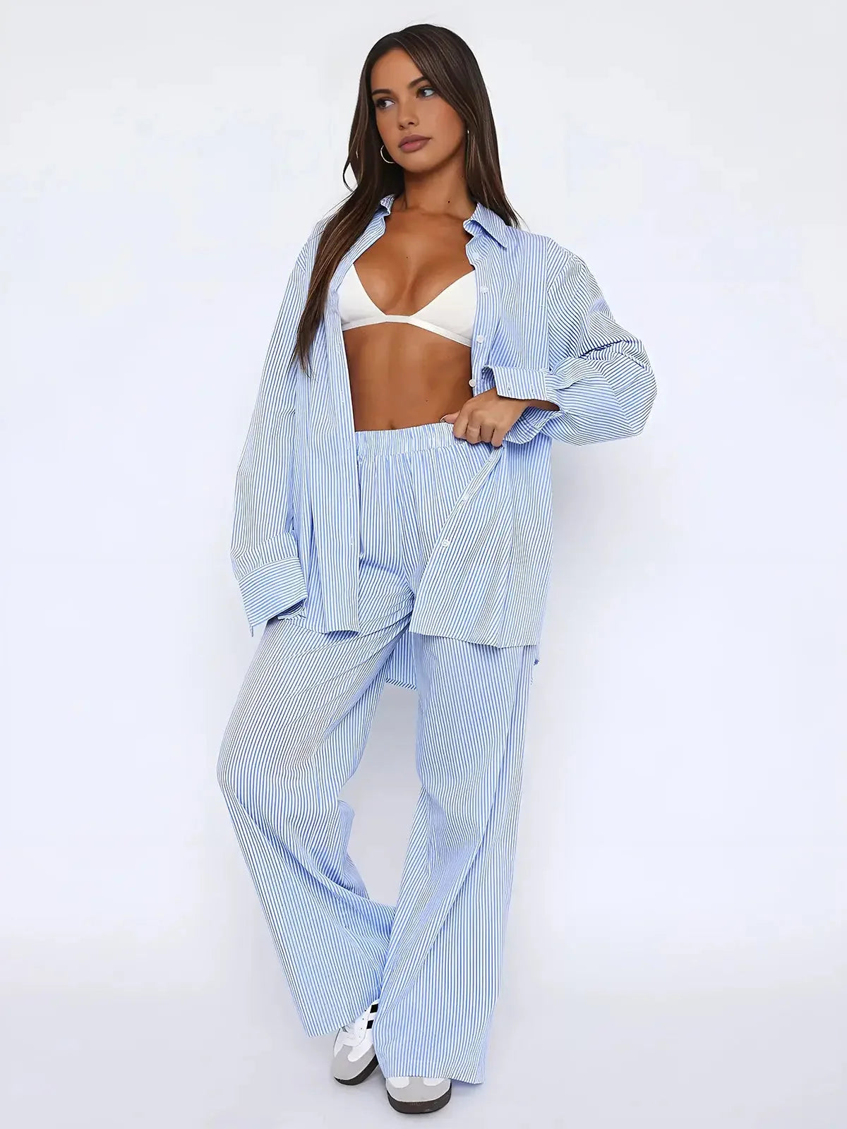 Women's blue striped wide-leg pants made from lightweight fabric with an elastic waist for comfort and easy styling.