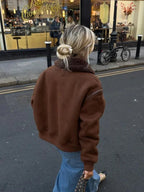 Women's brown aviator jacket featuring a faux shearling collar and a classic design, perfect for casual or outdoor wear.