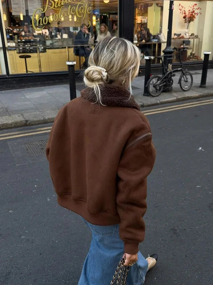 Women's brown aviator jacket featuring a faux shearling collar and a classic design, perfect for casual or outdoor wear.
