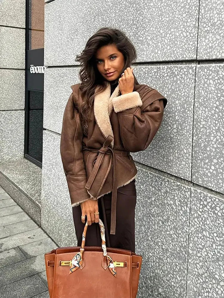 Women's brown belted coat featuring a plush shearling collar, crafted from warm fabric for comfort and style.