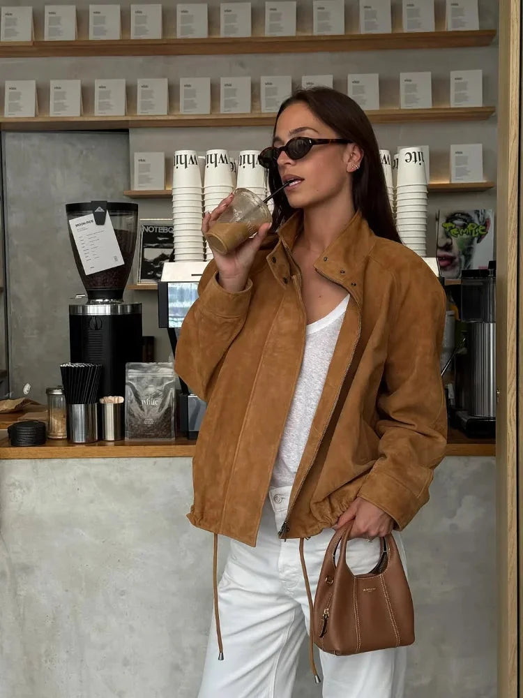 Brown cropped suede jacket for women featuring a zip closure and side pockets for a stylish and practical look.