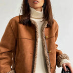 Women's brown fleece coat featuring a button front, soft material, and a relaxed fit for comfort during chilly days.