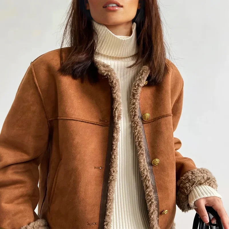 Women's brown fleece coat featuring a button front, soft material, and a relaxed fit for comfort during chilly days.