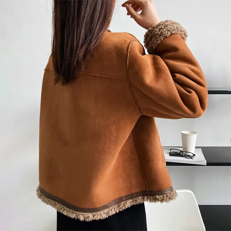 Women's brown fleece coat featuring a button front and soft, warm material, perfect for chilly weather.
