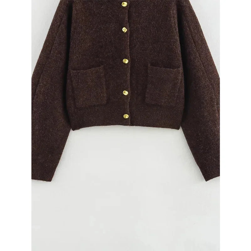 Women's brown knit cardigan featuring long sleeves and pockets, crafted from soft, cozy fabric for warmth and style.