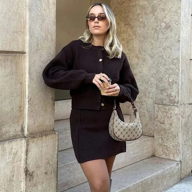 Women's brown knit cardigan featuring long sleeves and practical pockets, perfect for casual layering in colder weather.