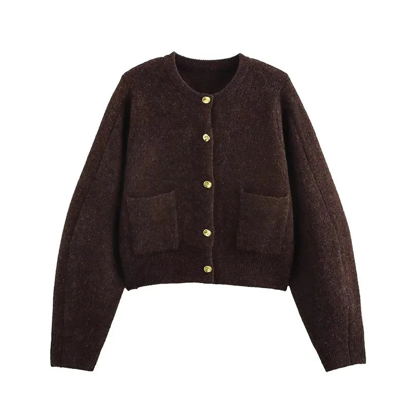Women's brown knit cardigan featuring long sleeves, functional pockets, and a cozy design, perfect for layering.