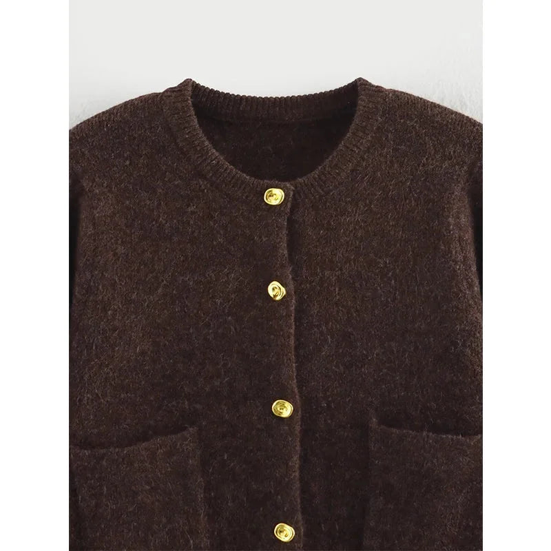 Women's brown knit cardigan featuring long sleeves, pockets, and a cozy design ideal for layering in cooler weather.