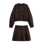 Women's brown knit cardigan featuring long sleeves, pockets, and a cozy ribbed texture for comfort and style.