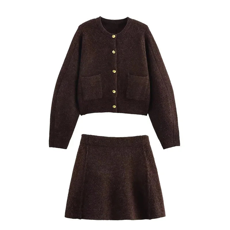 Women's brown knit cardigan featuring long sleeves, pockets, and a cozy ribbed texture for comfort and style.