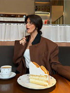 Women's brown lapel neck jacket featuring two pockets, crafted from soft fabric for a comfortable fit and modern style.
