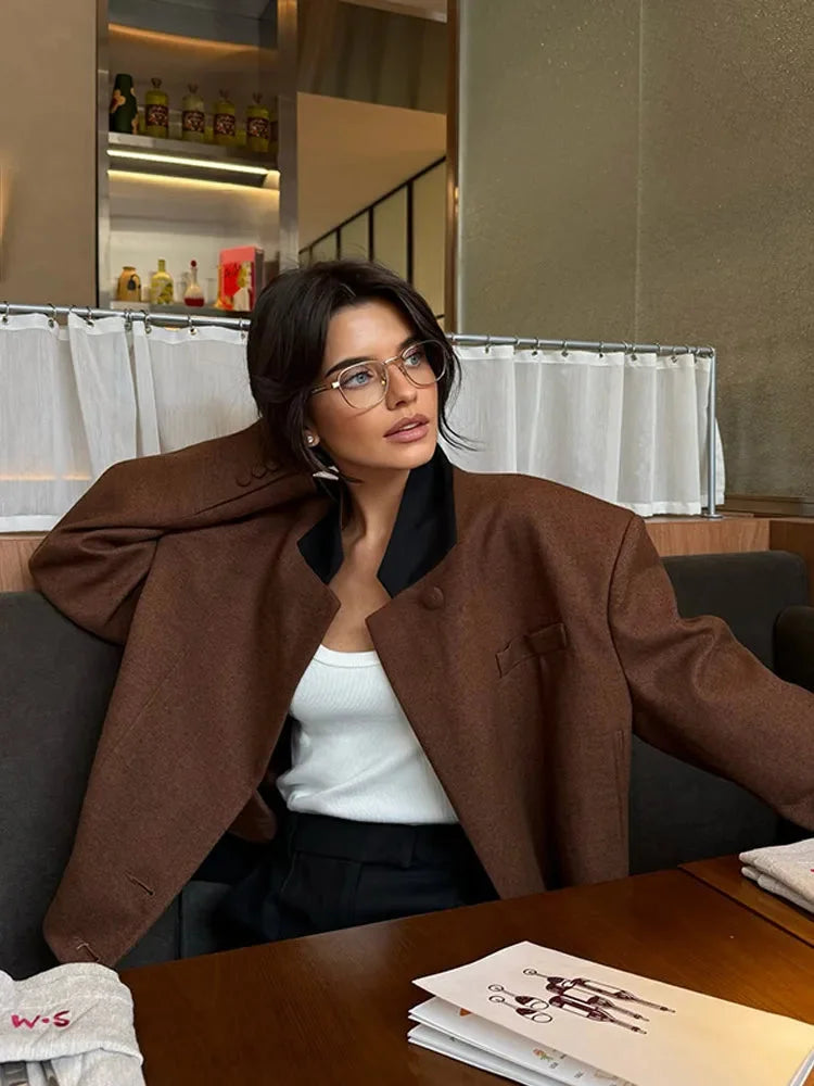Women's brown lapel neck jacket made of heavy cotton, featuring two spacious pockets and a tailored fit for a stylish look.