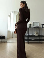 Women's brown ruched maxi dress with turtleneck, featuring soft fabric and a flattering silhouette for comfortable all-day…