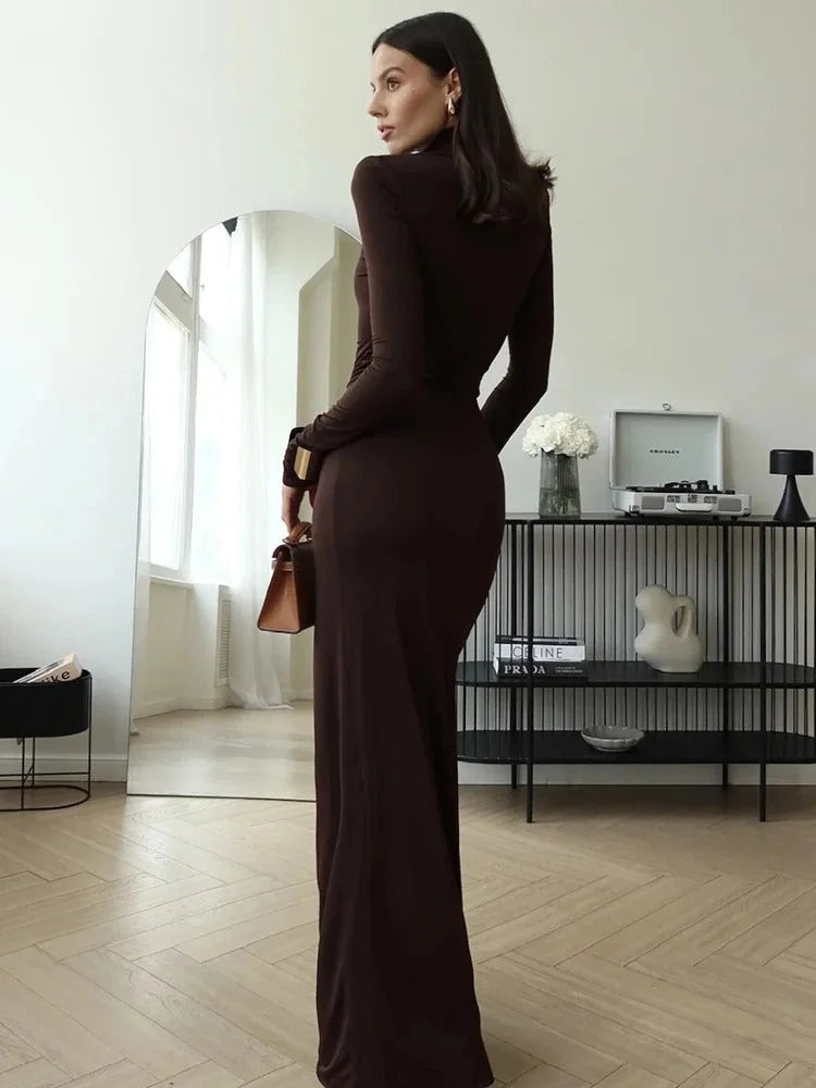 Women's brown ruched maxi dress with turtleneck, featuring soft fabric and a flattering silhouette for comfortable all-day…
