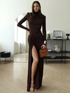 Women's brown ruched maxi dress with turtleneck, crafted from soft fabric, featuring a flattering silhouette and elegant…