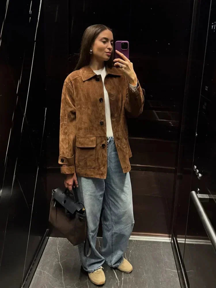 Women's brown suede-look short jacket with a collared design and front pockets, perfect for casual layering.