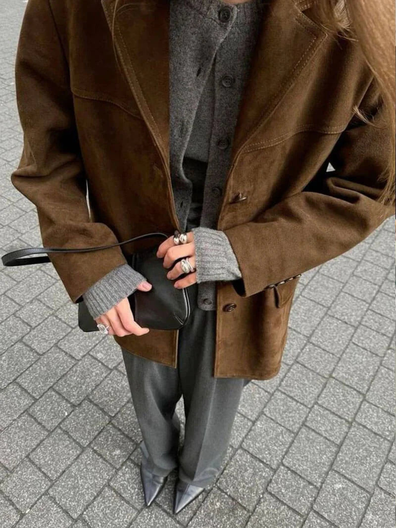 Women's brown suede-look jacket featuring a button-up front and a textured finish for a stylish, casual look.