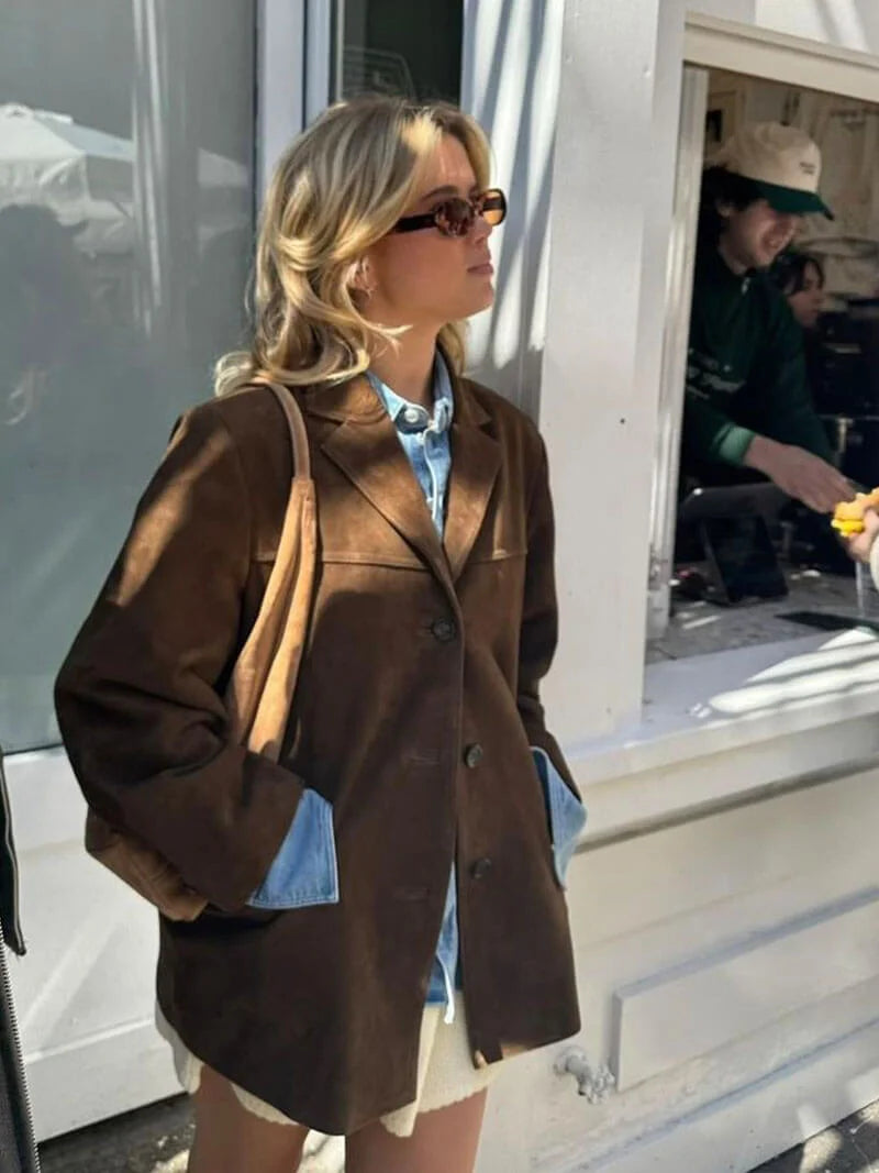 Women's brown suede-look jacket featuring a button-up front and classic design for a stylish, casual look.
