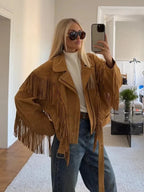 Women's brown long sleeve jacket with tassel accents, crafted from soft fabric, perfect for fall layering.