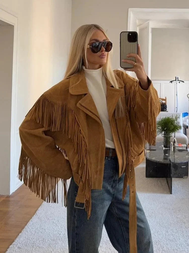 Women's brown long sleeve jacket with tassel accents, crafted from soft fabric, perfect for fall layering.