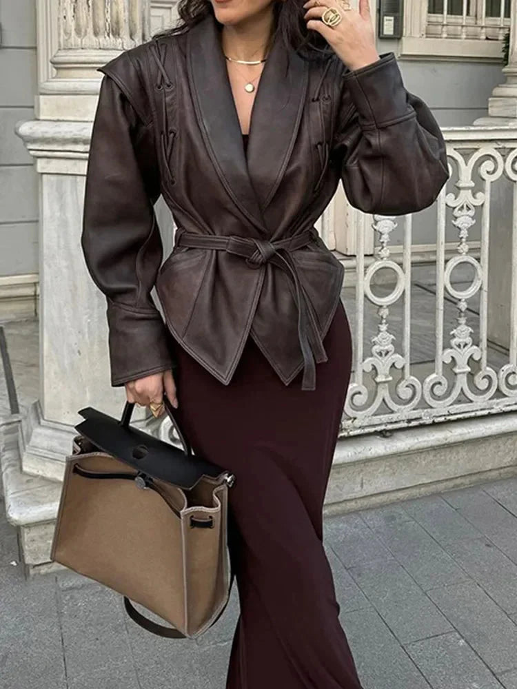 Women's brown tie-waist jacket featuring a structured design and made from a soft, durable fabric for comfortable wear.