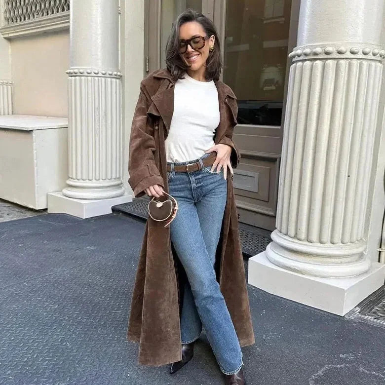 Women's brown trench coat featuring wide lapels, a tie waist, and a sleek silhouette in breathable fabric for comfort.